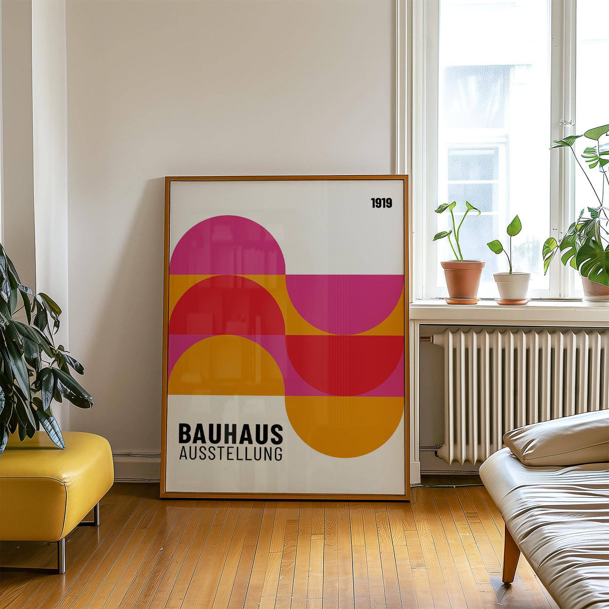 Large Artwork for Walls leaning on floor with semi-circles in pink red and orange beside plants on window sill