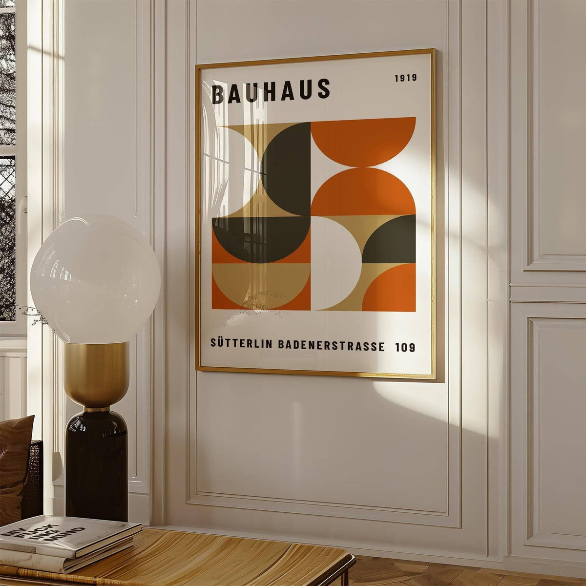Office wall decor framed print with geometric shapes in terracotta and brown with a lamp nearby