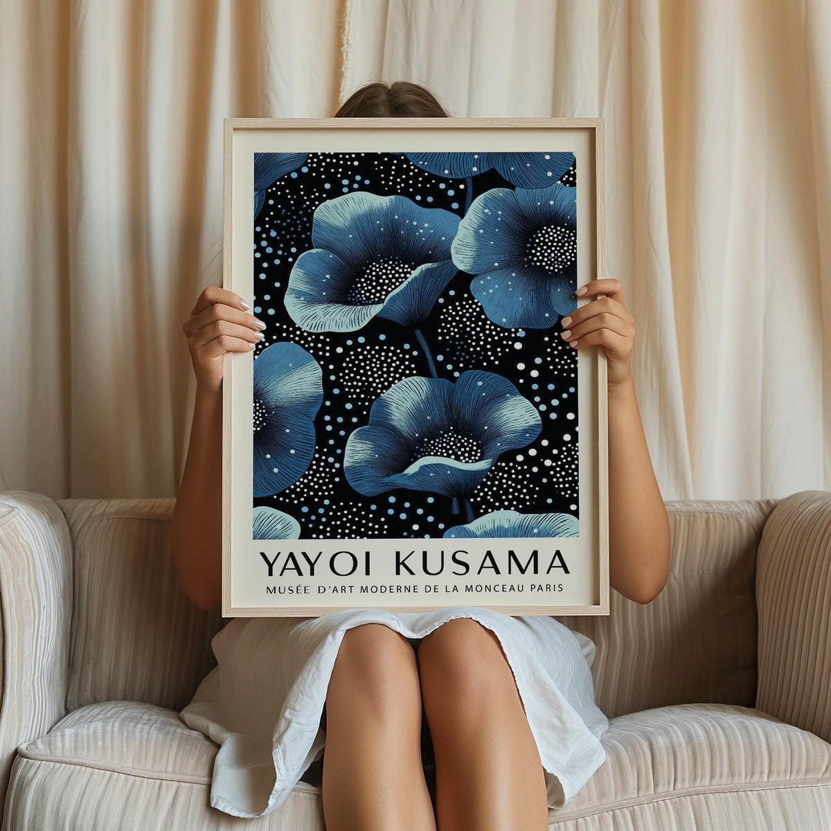 Framed Wall Art Blue Flowers of large blue blossoms with white dots held by person on sofa