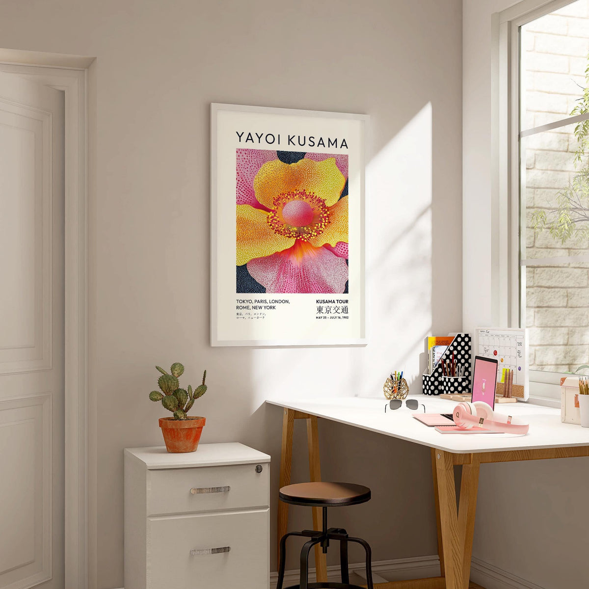 Floral art prints framed print of yellow and pink flower with black dots above a white filing cabinet
