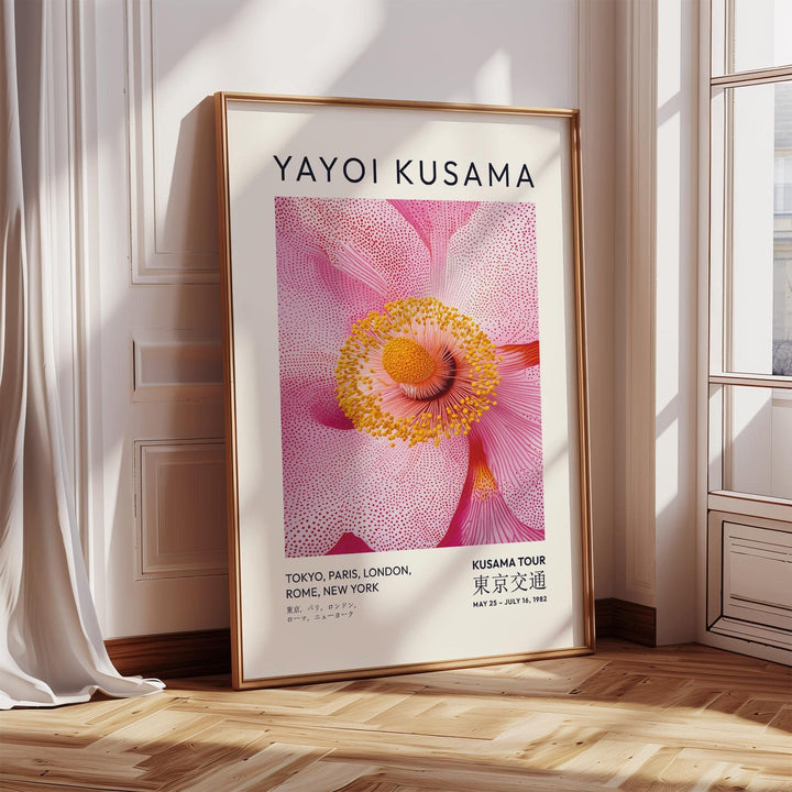 Abstract Pink Wall Art print leaning on wooden floor near sunlit window with white curtain