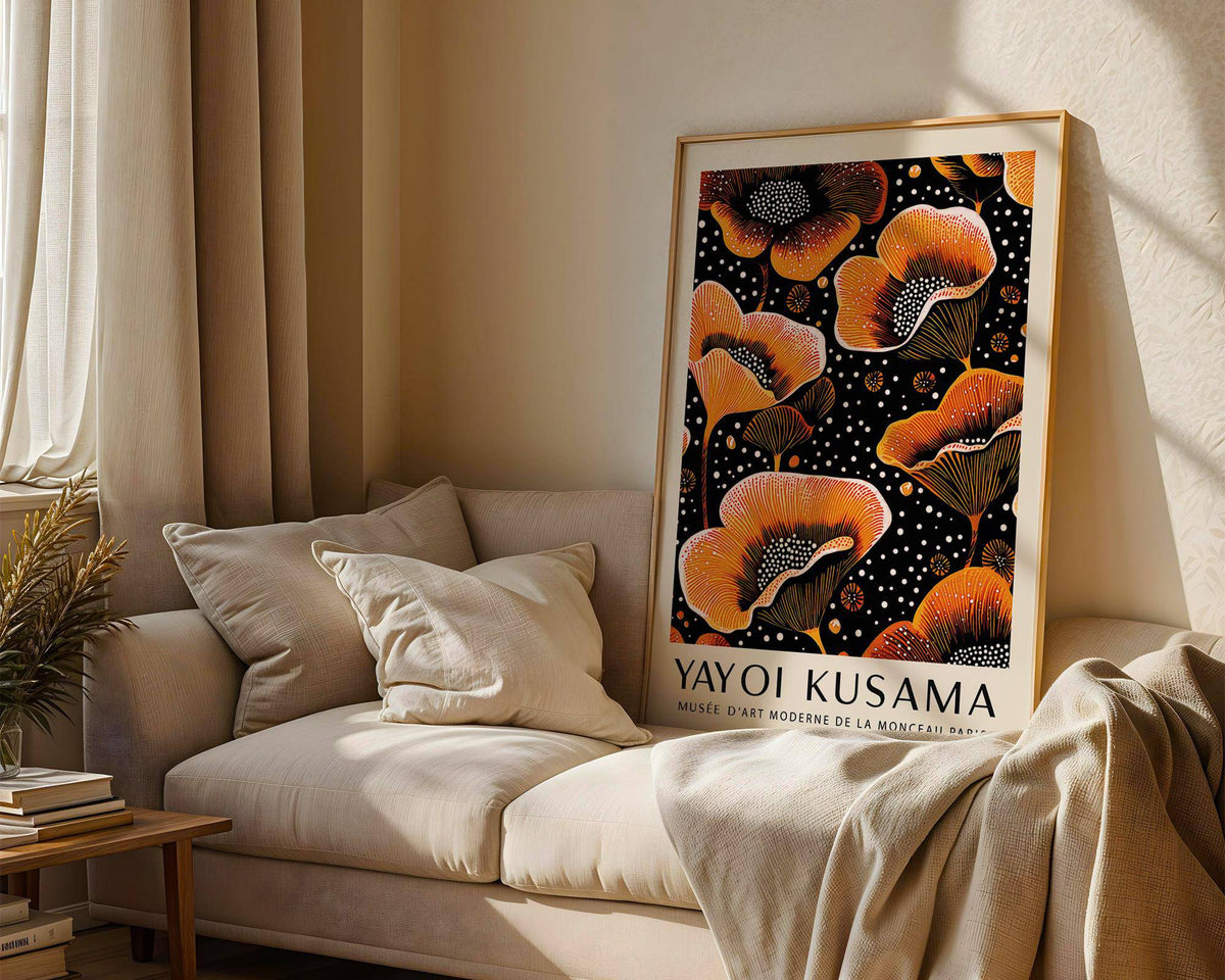 Orange print leaning on a beige sofa with cushions and soft lighting in the living room