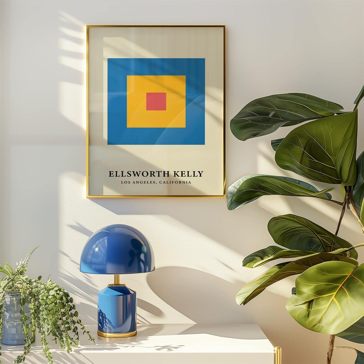 Minimalist Art framed print showing concentric red yellow and blue blocks with a blue lamp on a white surface nearby