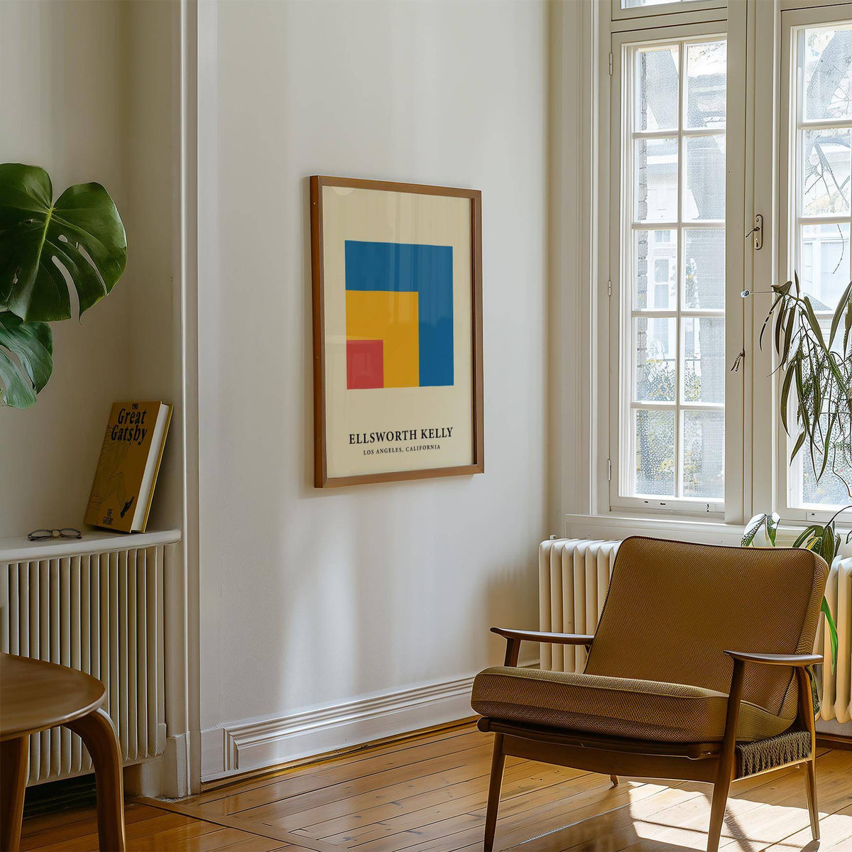 Modern Minimal Wall Art with colourful nested squares in a wooden frame in a bright sitting room with a brown armchair