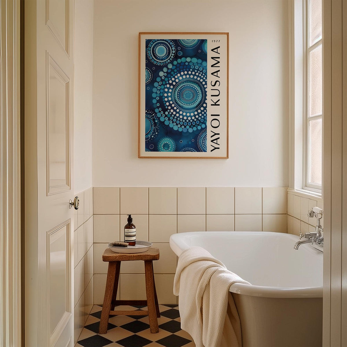 Mandala wall art with blue circular dot pattern above a wooden stool in a bathroom