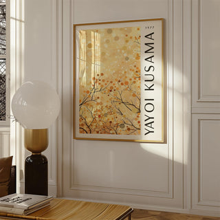 Yellow Nature Art framed print of abstract autumn branches hanging on a cream wall by a lamp