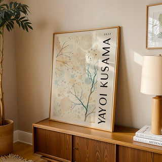 Nature Prints leaning print of abstract tree branches with circles on a wooden cabinet