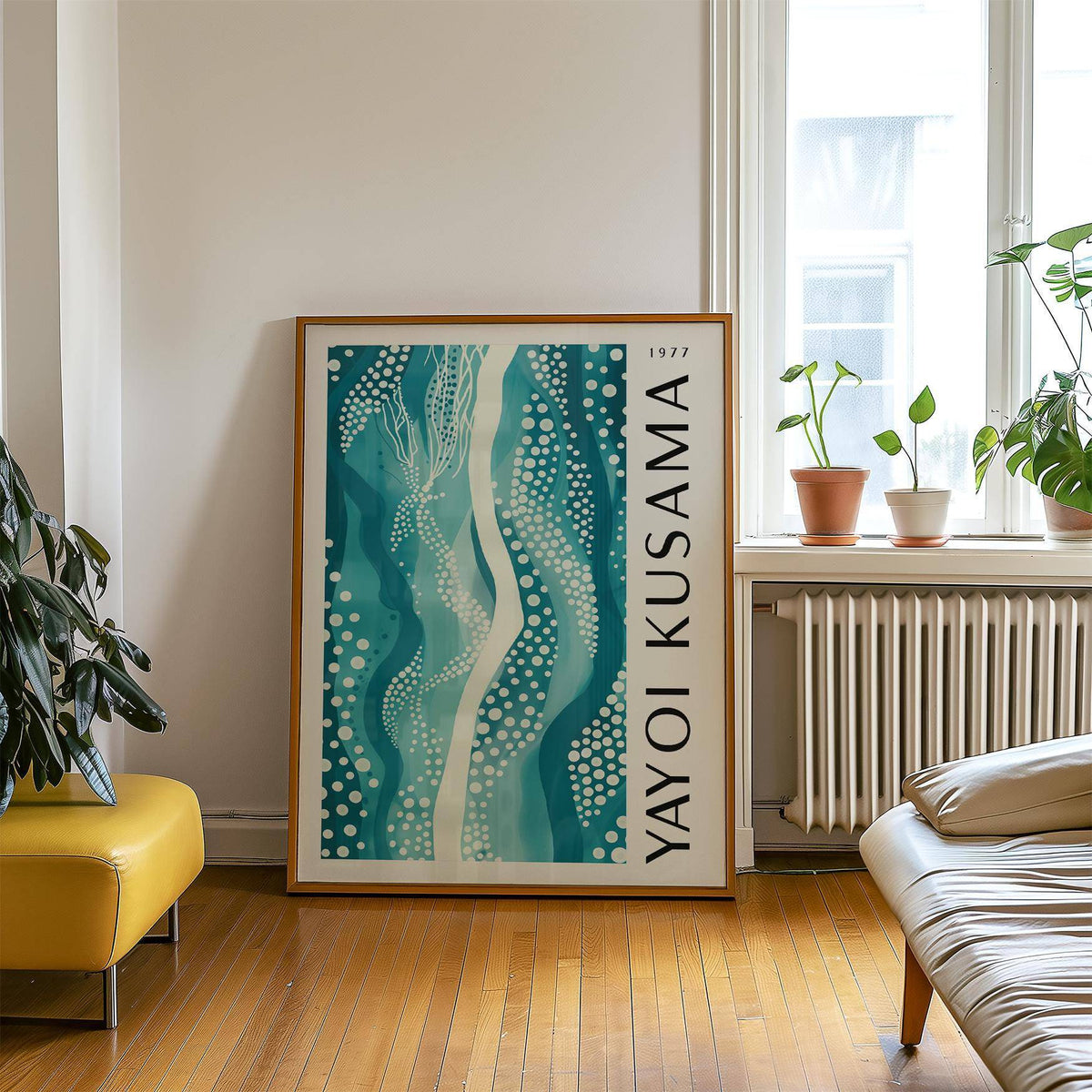 Abstract Picture leaning on floor with teal patterned artwork beside a mustard chair and green plant