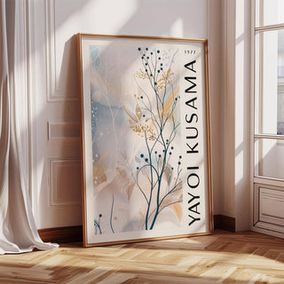 Large Neutral Wall Art leaning on floor with black branches and blue and beige leaves beside window