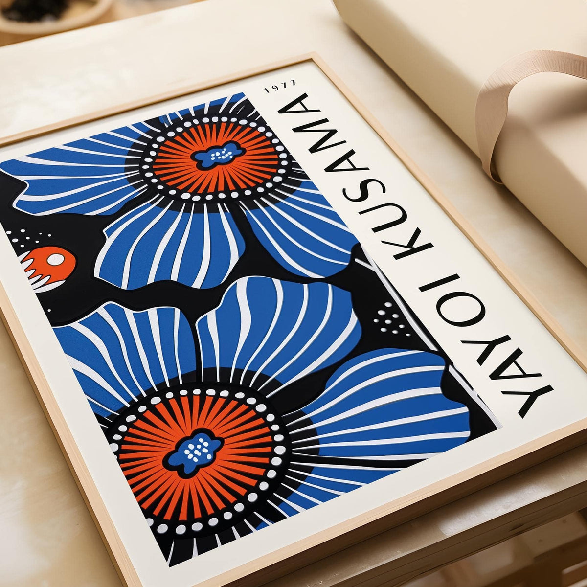 Framed Blue Floral Home Decor showing blue poppy flowers with red and black details on a table