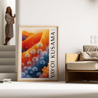 Blue Orange wall decor leaning against a wall beside a beige sofa in a modern living space