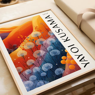 Blue Orange wall decor featuring abstract blue and orange flowers framed on a table with wrapping paper