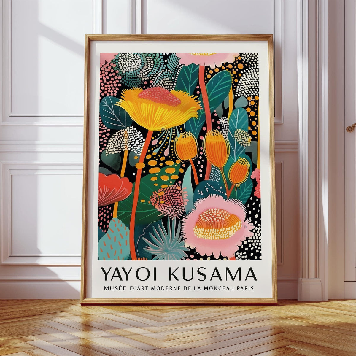 Large wall art modern framed print with bright yellow and pink abstract floral design leaning on floor against wall