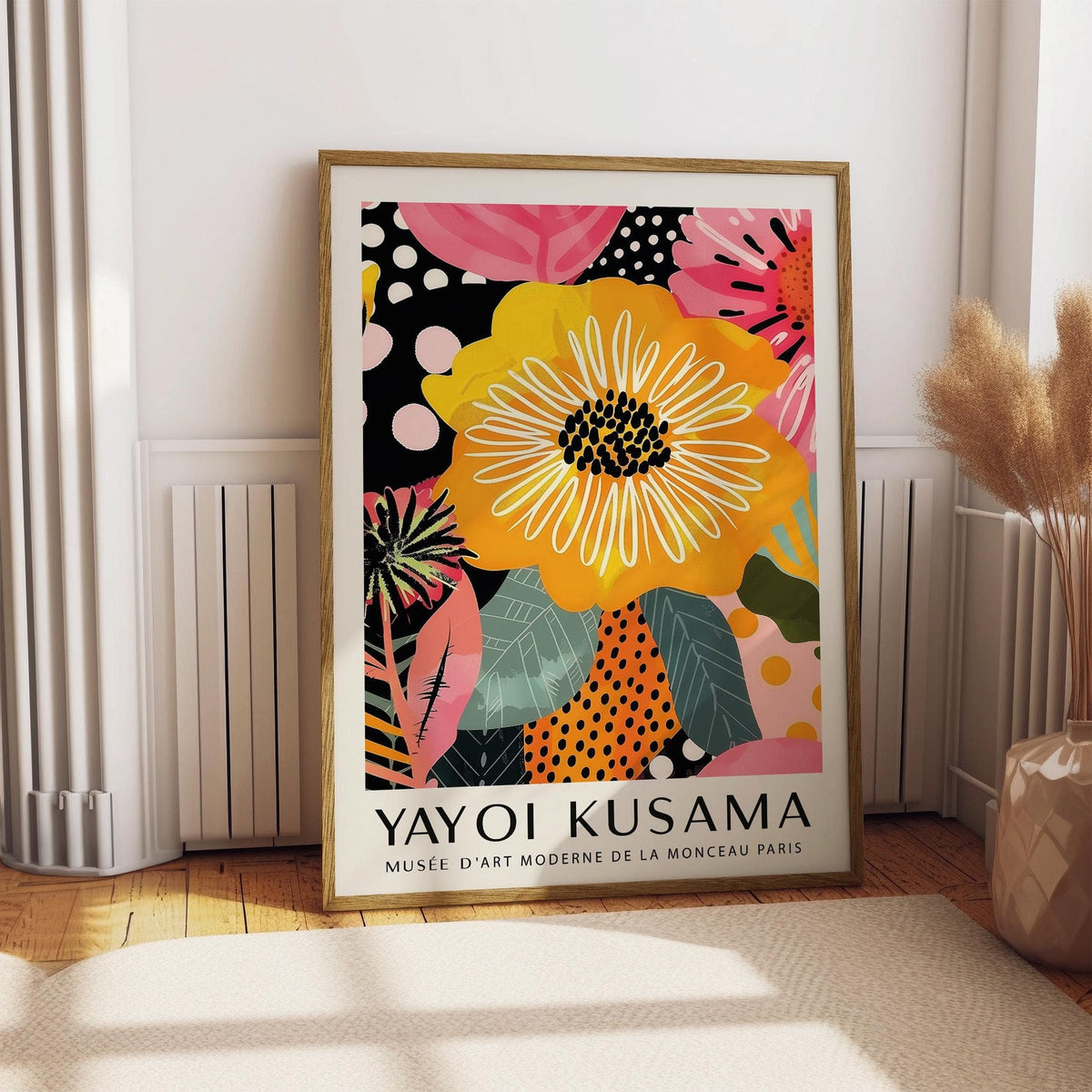 Abstract Art of Flowers print leaning on floor with yellow flower and pink leaves near dried flowers