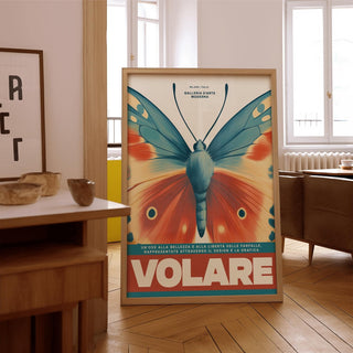 Butterfly wall art with vintage style orange and blue butterfly wings leaning on wooden floor near a wooden sideboard