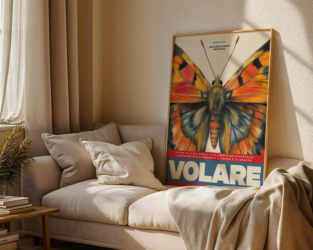 Butterfly art wall print with vibrant orange and blue butterfly wings leaning on a sofa with cushions