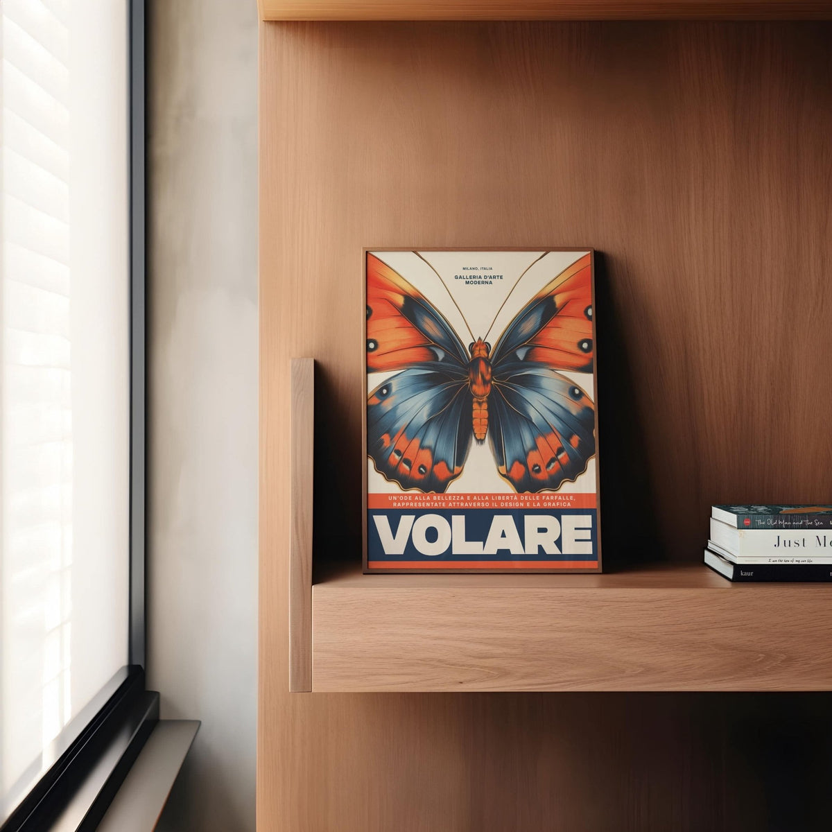 Print on a wooden shelf of a blue and orange butterfly with bold white text near a window