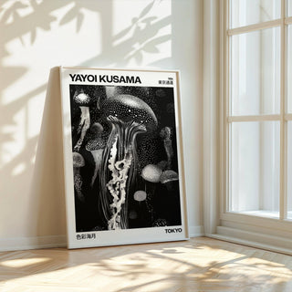Jellyfish art print leaning by a window with light and leaf shadows on the floor