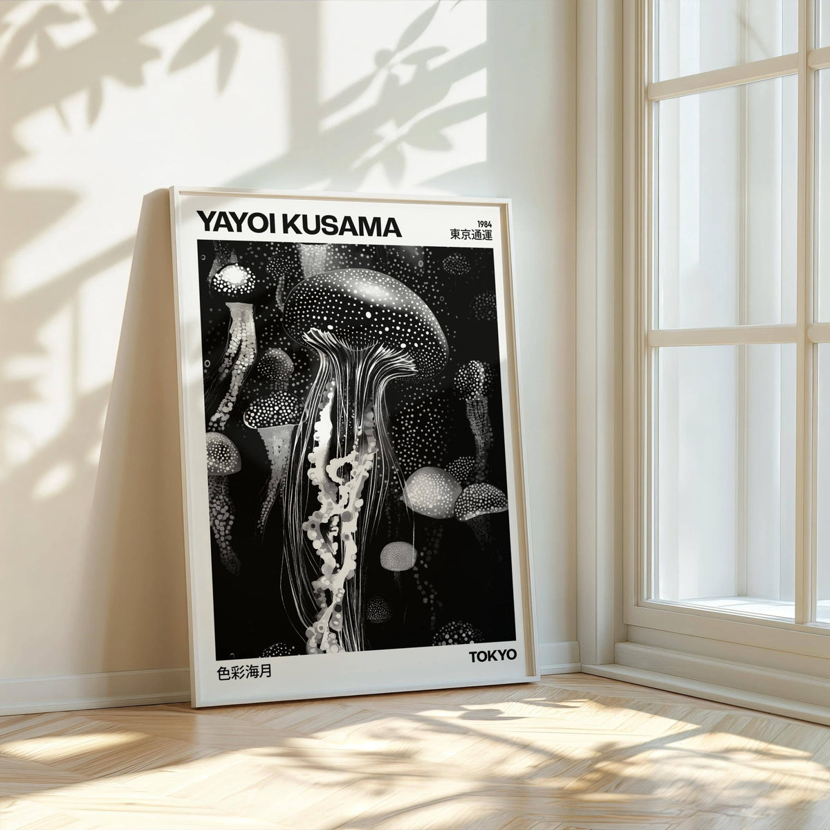 Jellyfish art print leaning by a window with light and leaf shadows on the floor
