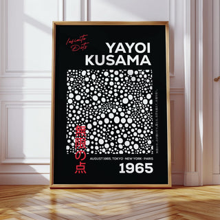 Wall Art Polka Dots print with white dots on black background leaning on a wooden floor