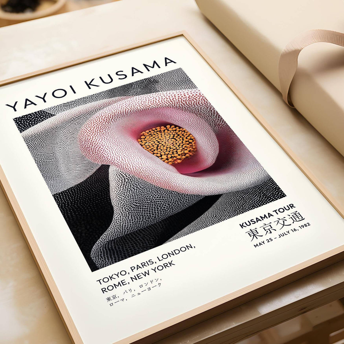 Framed Pink Abstract Artwork showing a pink calla lily flower with dotted textures on a flat surface with wrapping paper