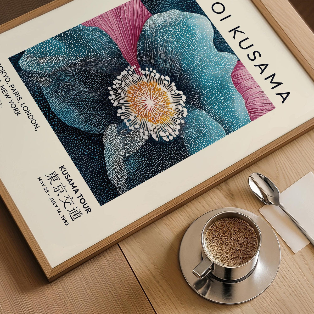 Blue Flower Artwork close-up of blue and pink botanical illustration with text beside a cup of coffee