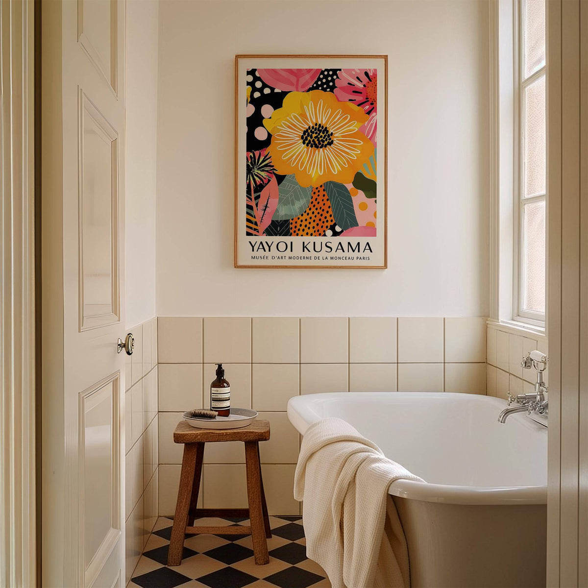 Abstract art of flowers with large yellow flower framed above a stool in a bathroom