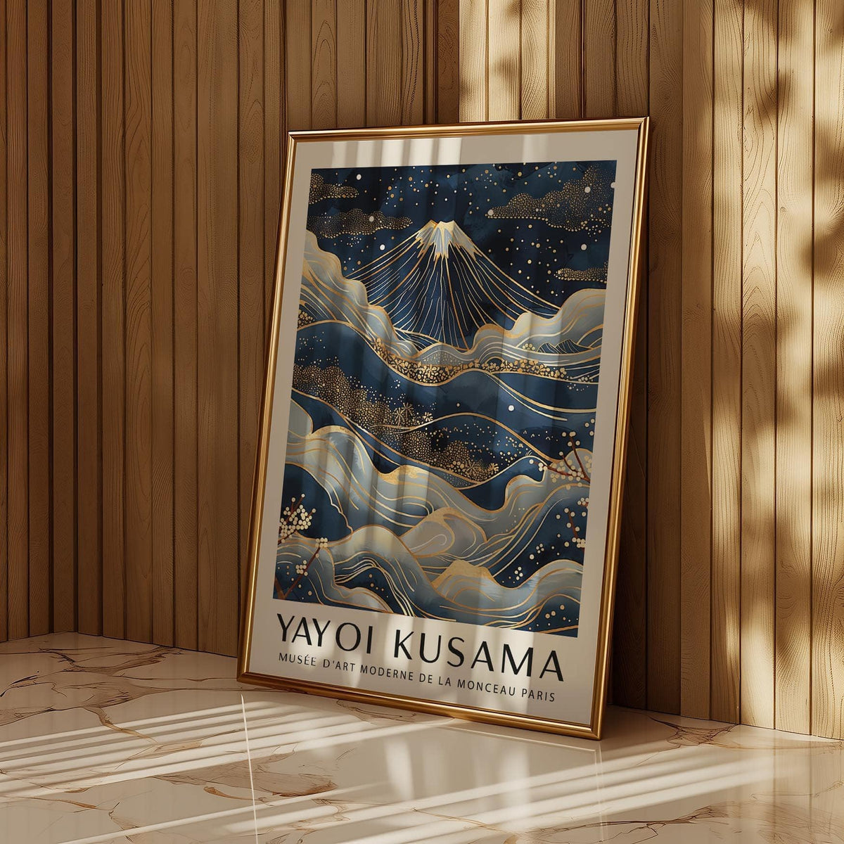 Framed poster from Japan with Japanese-ink style Mount Fuji and golden details leaning on a wooden wall