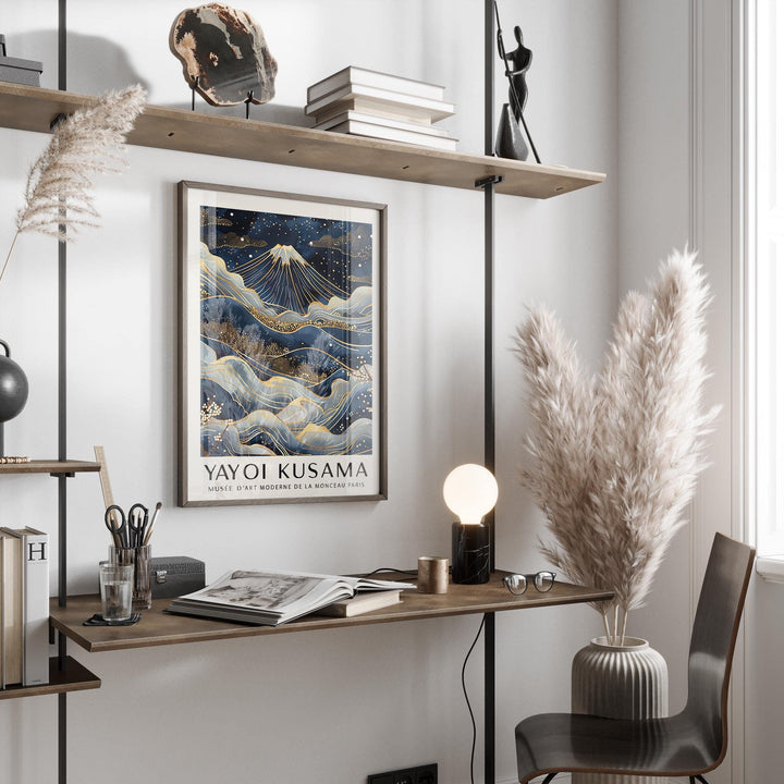 Posters from Japan wall art showing Mount Fuji with golden accents above a wooden desk with a lamp
