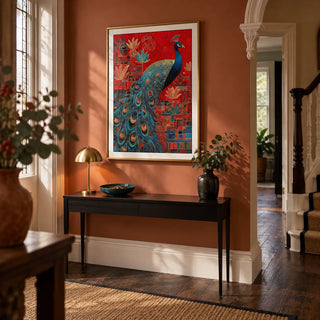 Indian Peacock Art Print, framed on the wall of a welcoming hallway in a renovated UK Edwardian house with muted terracotta walls and dark timber floorboards
