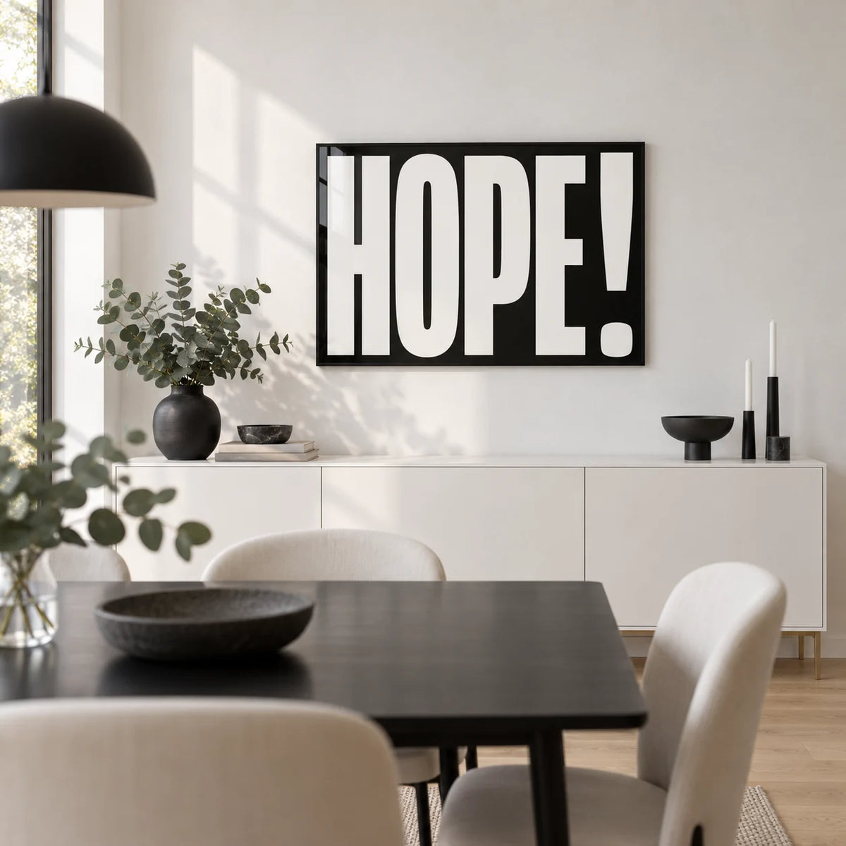 Inspirational Artwork, framed on the wall of a modern dining room with a white wall and a pale oak floor