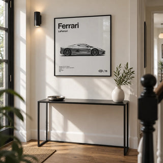 Italian Hybrid Hypercar Poster, framed on the wall of a crisp modern hallway in a renovated UK terrace with an off-white wall and warm timber floorboards
