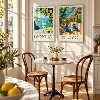 Italian Kitchen Prints Set of 2 styled above a marble bistro table in a sunny Parisian kitchen: Amalfi Limoncello and Amalfi Espresso shown framed side by side (frames not included)