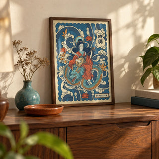 Japanese Goddess Wall Art, a small A4 framed print leaning on a walnut sideboard in a living room