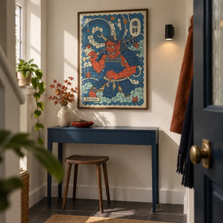 Japanese Oni Mask Print, framed on the wall of a narrow entrance hallway in a contemporary UK maisonette with a cream wall and plain charcoal floor tiles