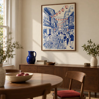 Japanese Street Market Art, framed on the wall of a compact dining room in a renovated UK terrace with a warm cream wall and walnut furniture