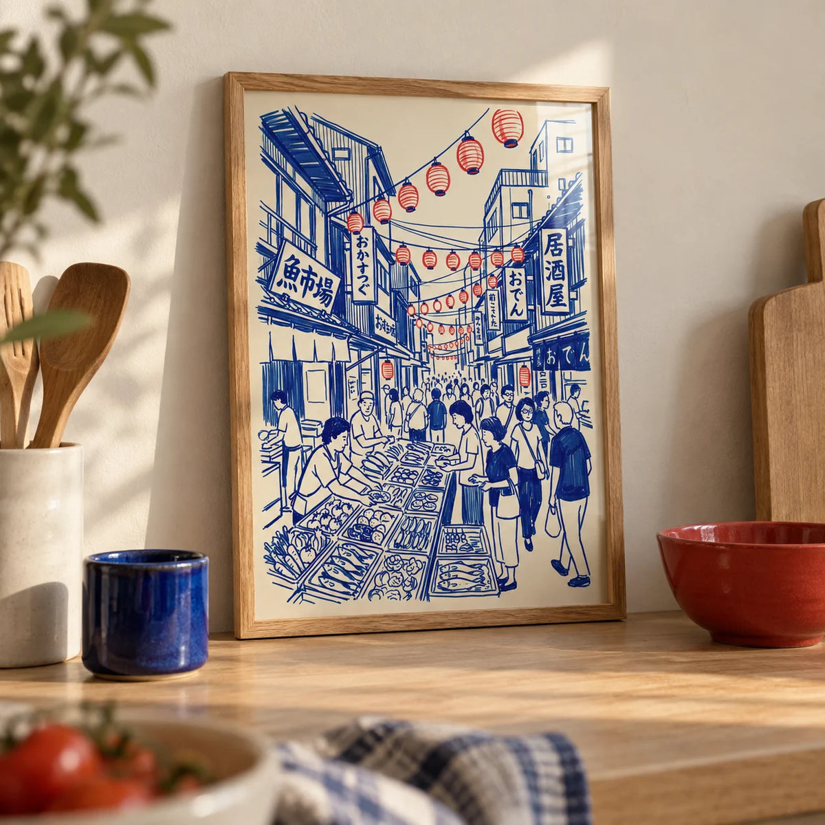 Japanese Street Market Art, a small A4 framed print leaning on a pale oak kitchen worktop