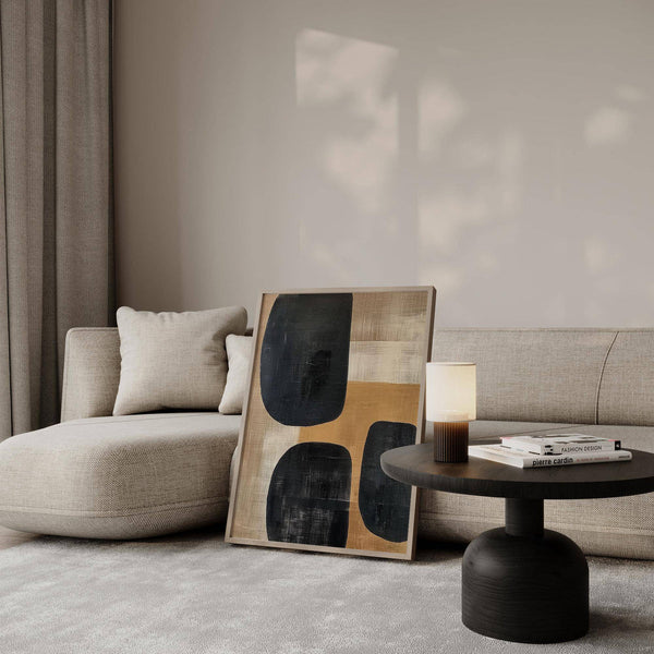 Earthy abstract art print beside a linen sofa