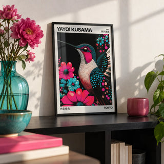 Large Bird Prints, a small A4 framed print leaning on a black shelf in a living room