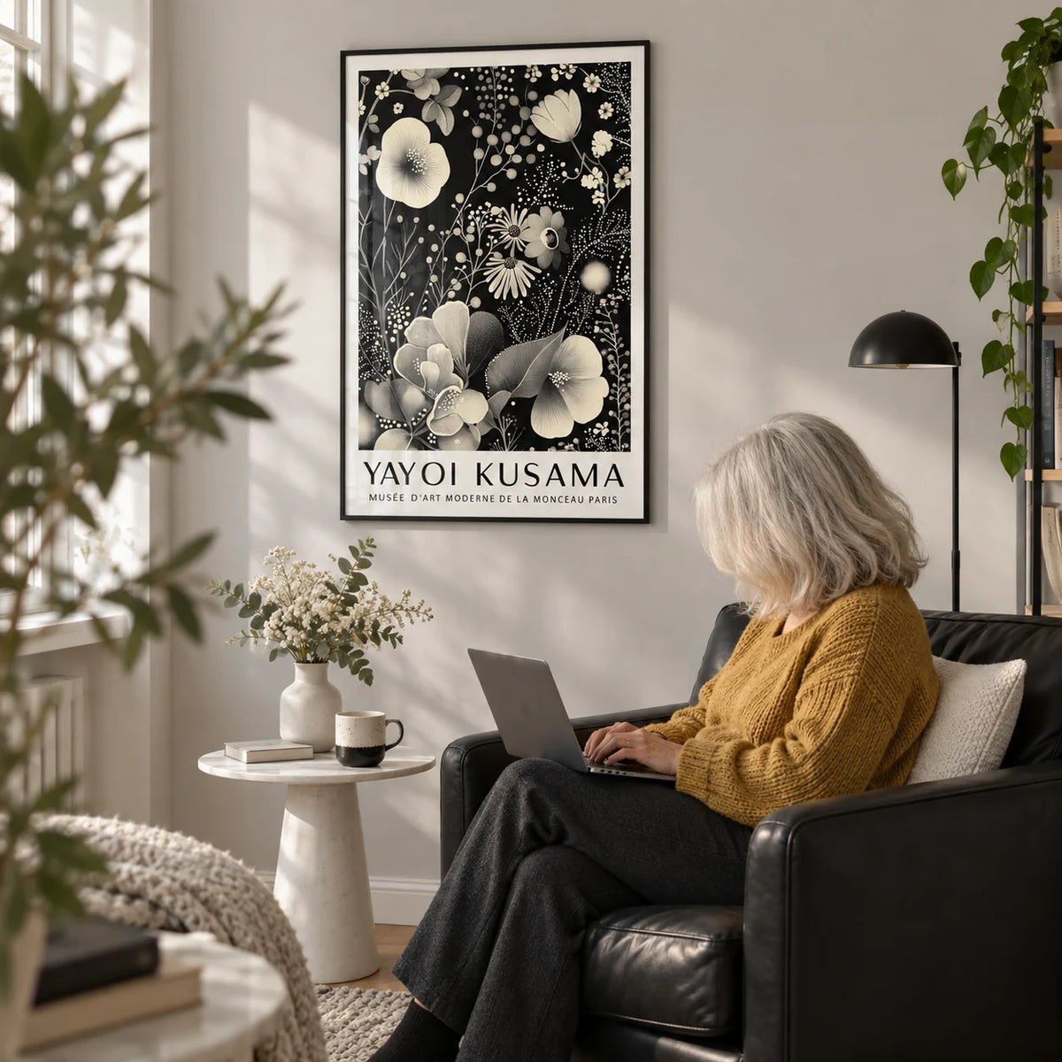 Large Floral Wall Art, framed on the wall of a reading corner with a pale grey wall in a living room