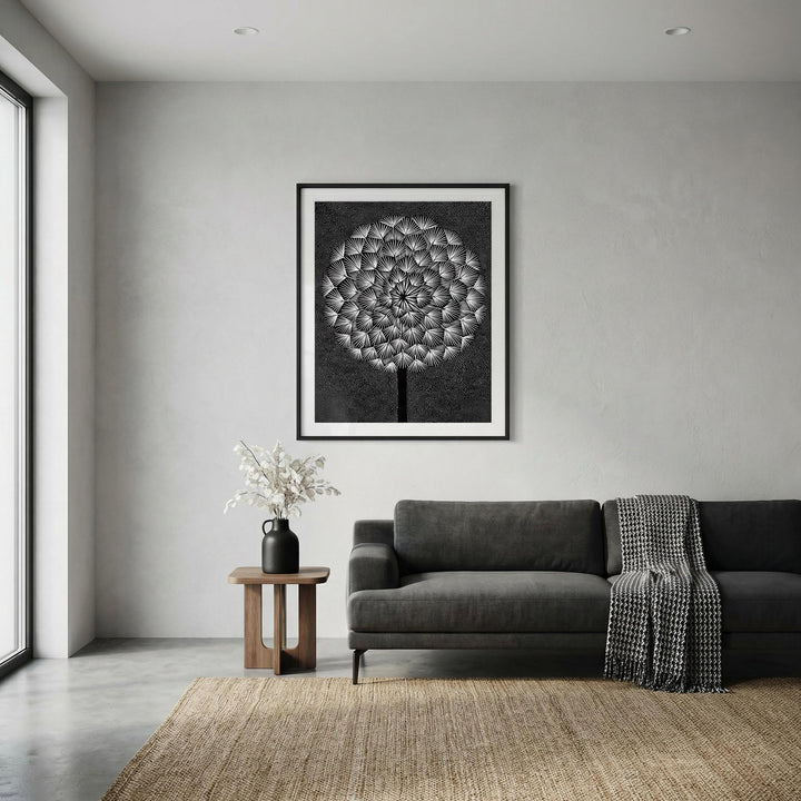 Dandelion wall print in black and white abstract style above a dark grey sofa