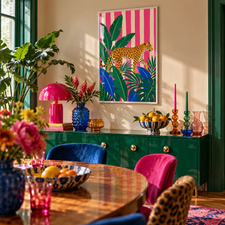 Leopard Prowl Poster, framed on the wall of a maximalist dining room