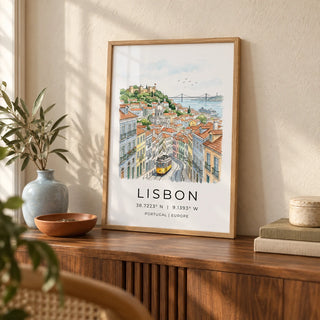 Lisbon City Art Print, a small A4 framed print leaning on a walnut side table in a hallway