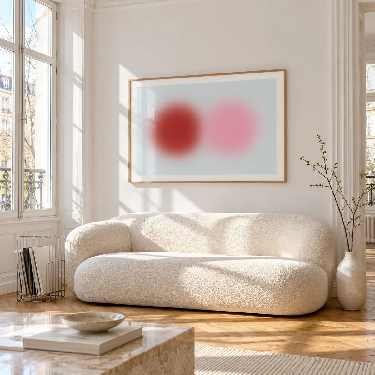 Red and Pink Circles Print, framed on the wall of a bright living room corner