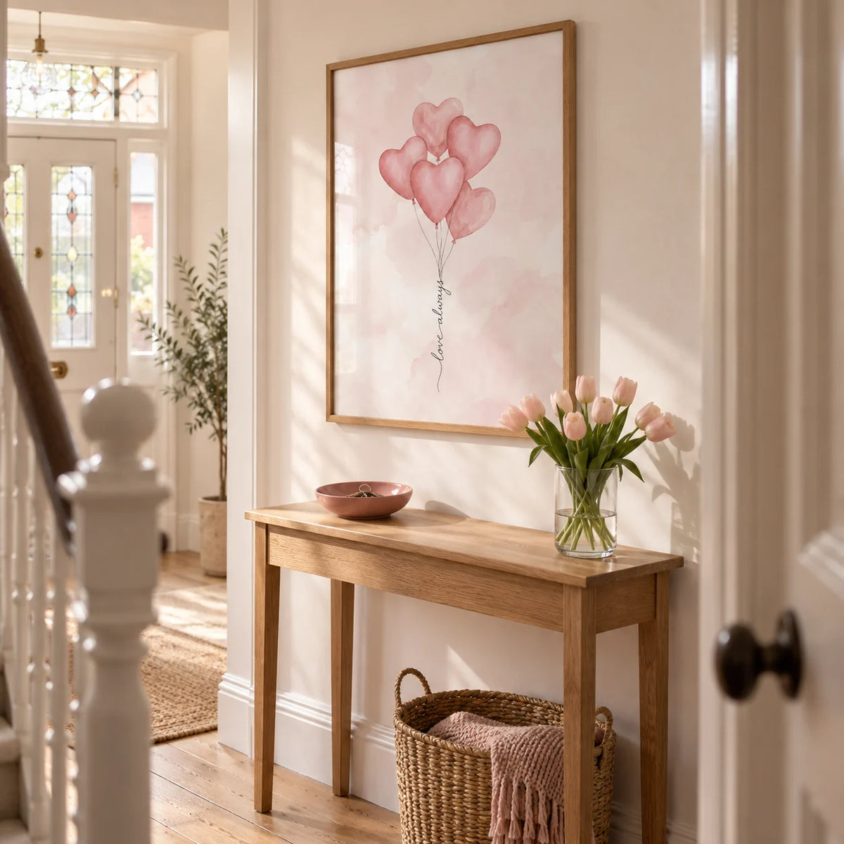 Love Heart Balloon Art Print, framed on the wall of a welcoming narrow hallway in a Victorian terrace with warm white plaster walls and pale timber flooring