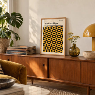 Manchester Art Print, a small A4 framed print leaning on a teak sideboard in a living room