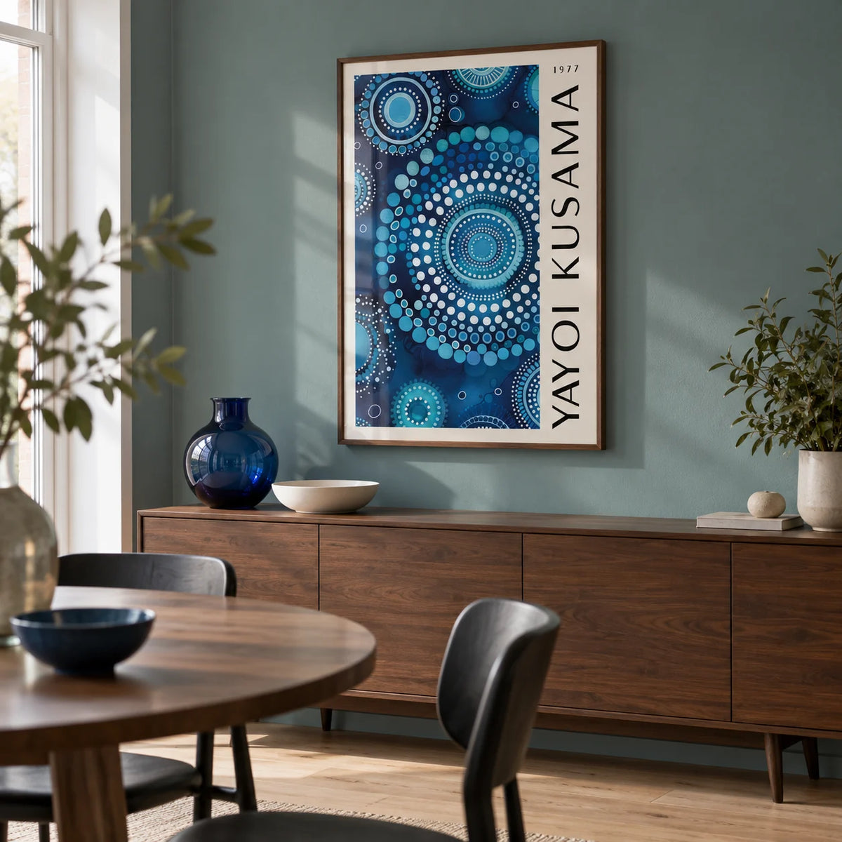 Mandala Wall Art, framed on the wall of a modern dining room in a UK flat with a muted teal wall and pale timber flooring