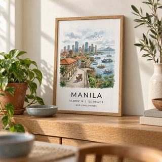 Manila City Art Print, a small A4 framed print leaning on a narrow oak side table in a hallway