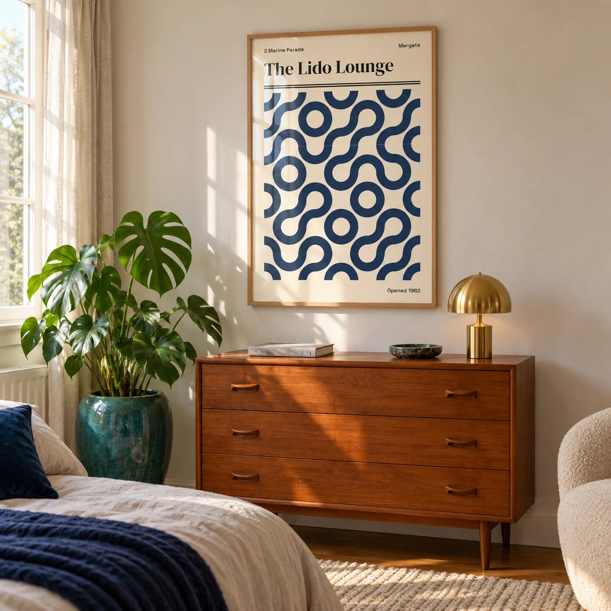 Margate Print, framed on the wall of a bright bedroom corner with a pale wall