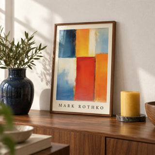 Mark Rothko Orange Red and Yellow, a small A4 framed print leaning on a walnut sideboard in a living room
